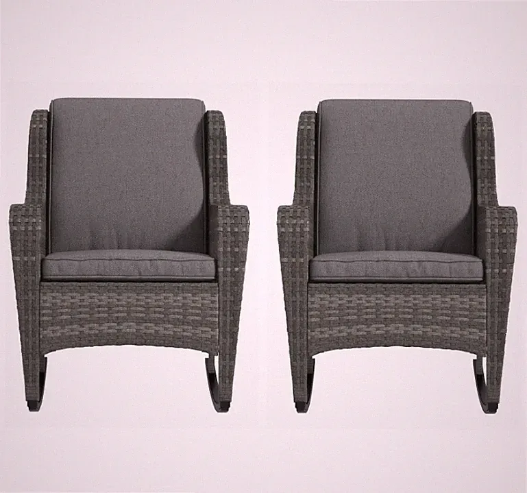 A pair of rattan rocking chairs perfect for relaxing on the patio or garden